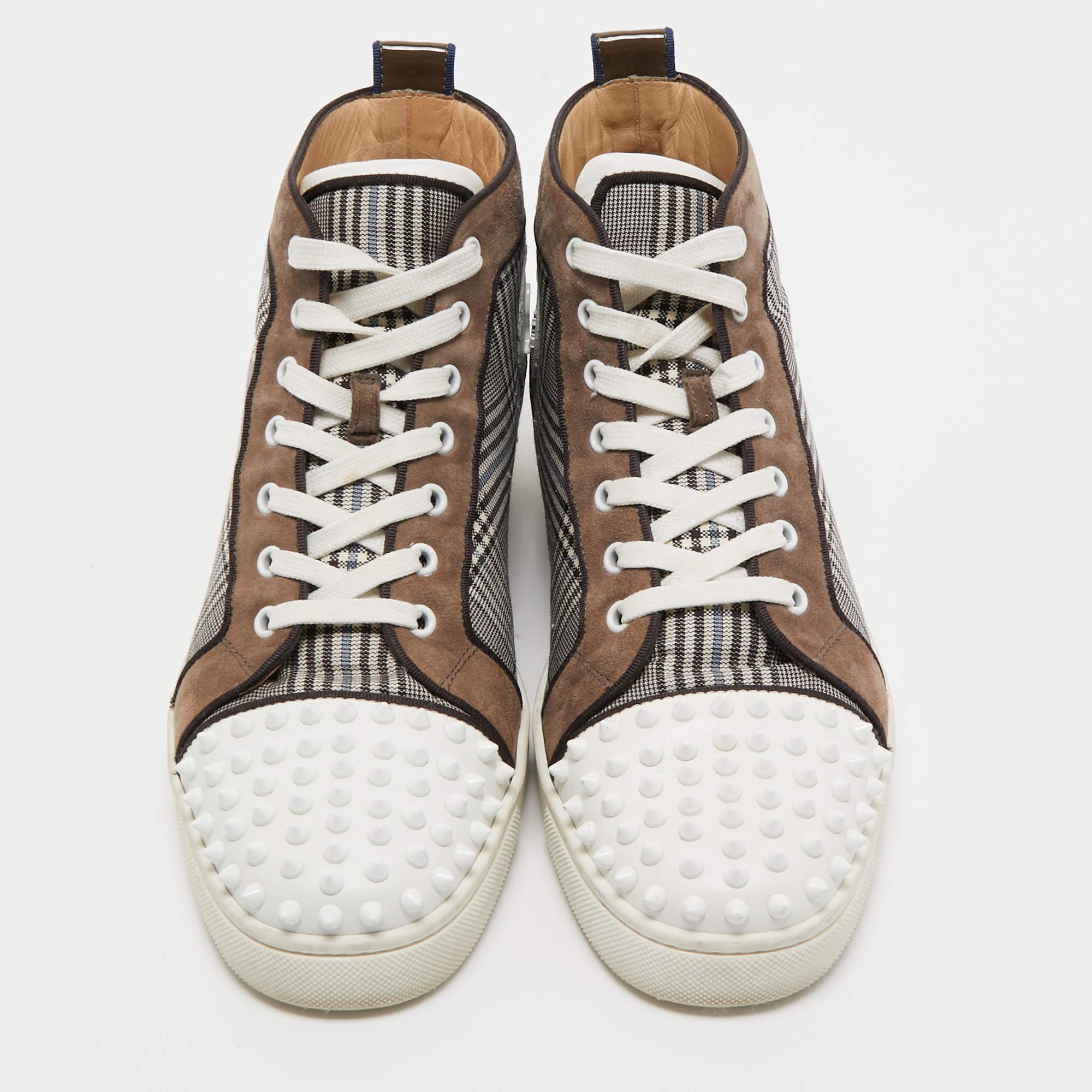 We see the 'punk rock' aesthetic of the Christian Louboutin brand well-translated on these sneakers. They are crafted from check fabric as well as leather and feature spikes decorated on the cap toes. Lace-ups and leather insoles complete them. The