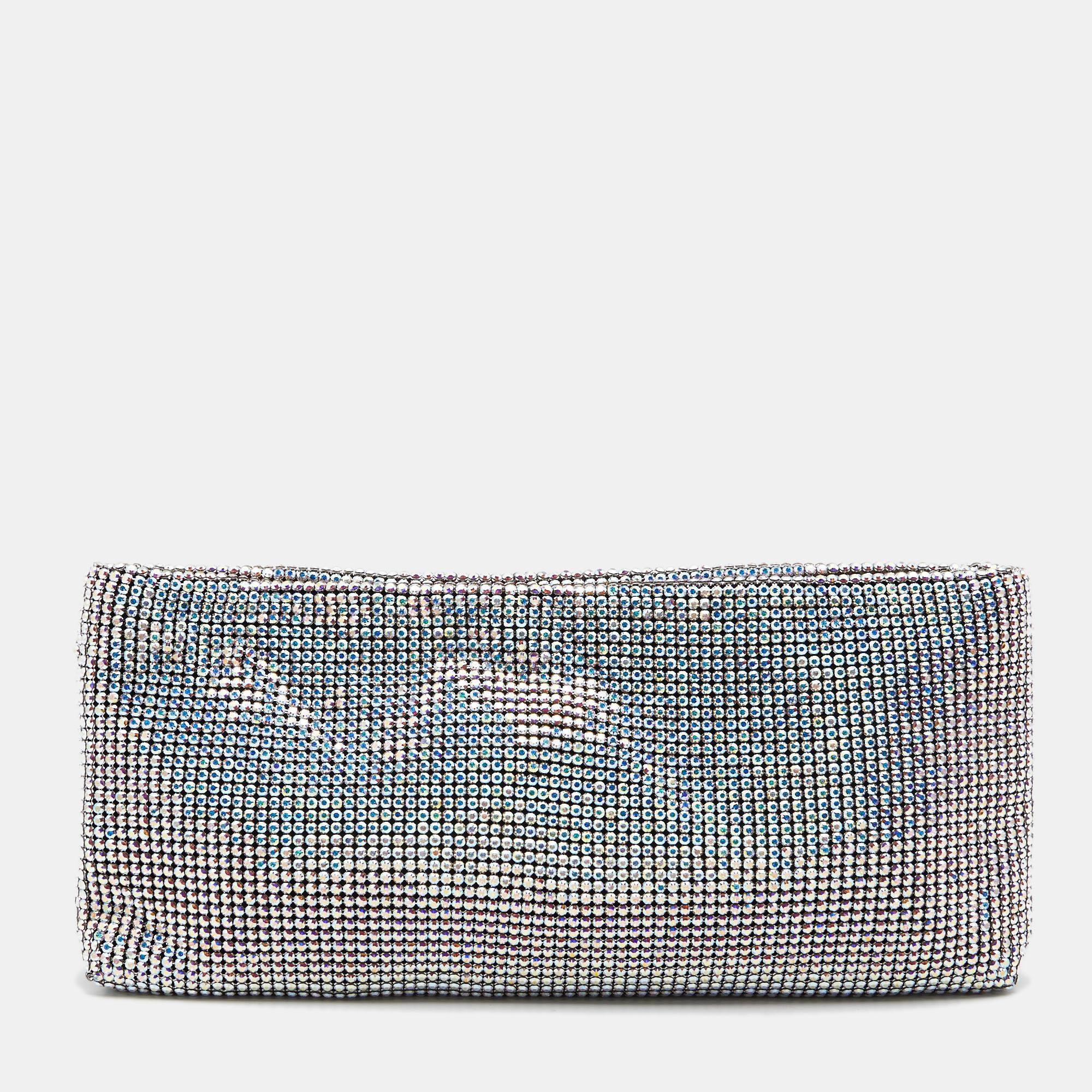 Christian Louboutin presents to you this shimmering clutch for parties and night outings! It is crafted from sparkling crystals and silver-tone hardware. It is complete with a well-sized fabric interior.

Includes: Original Dustbag