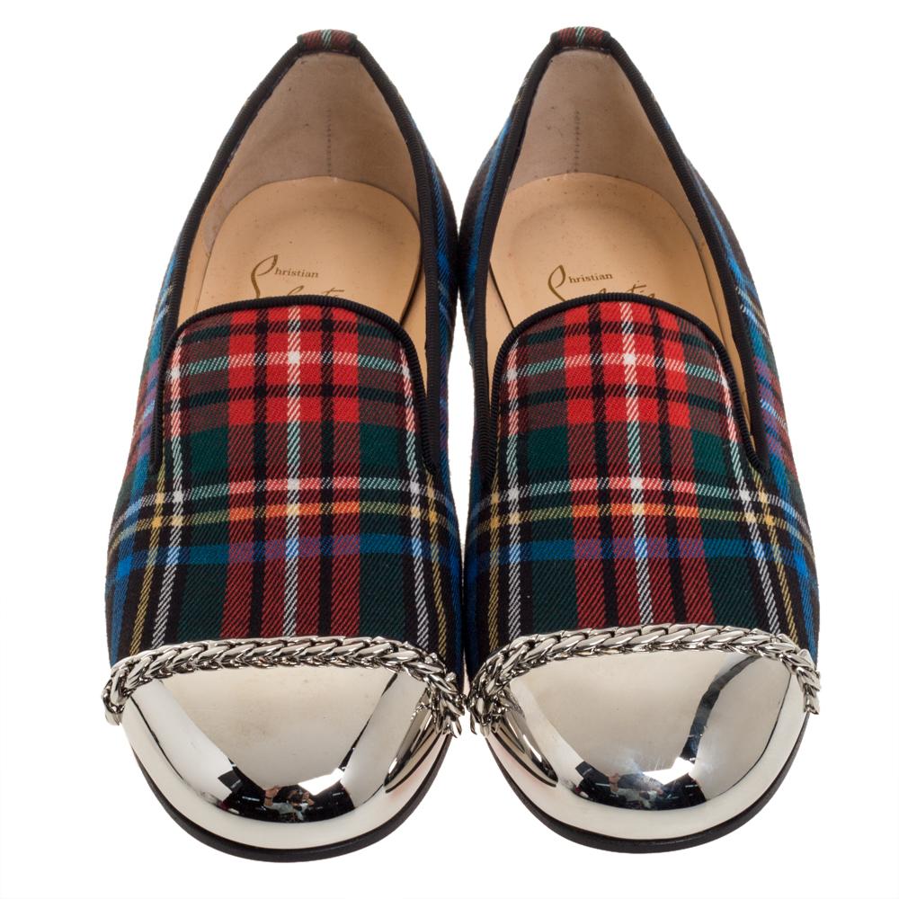 Opt for a pair of smart Christian Louboutin loafers like this one, and wear it for a casual outing. Made from fabric in multiple hues, they feature a tartan pattern, metallic cap toes, chain-link details, and stacked heels. Wear them with cropped