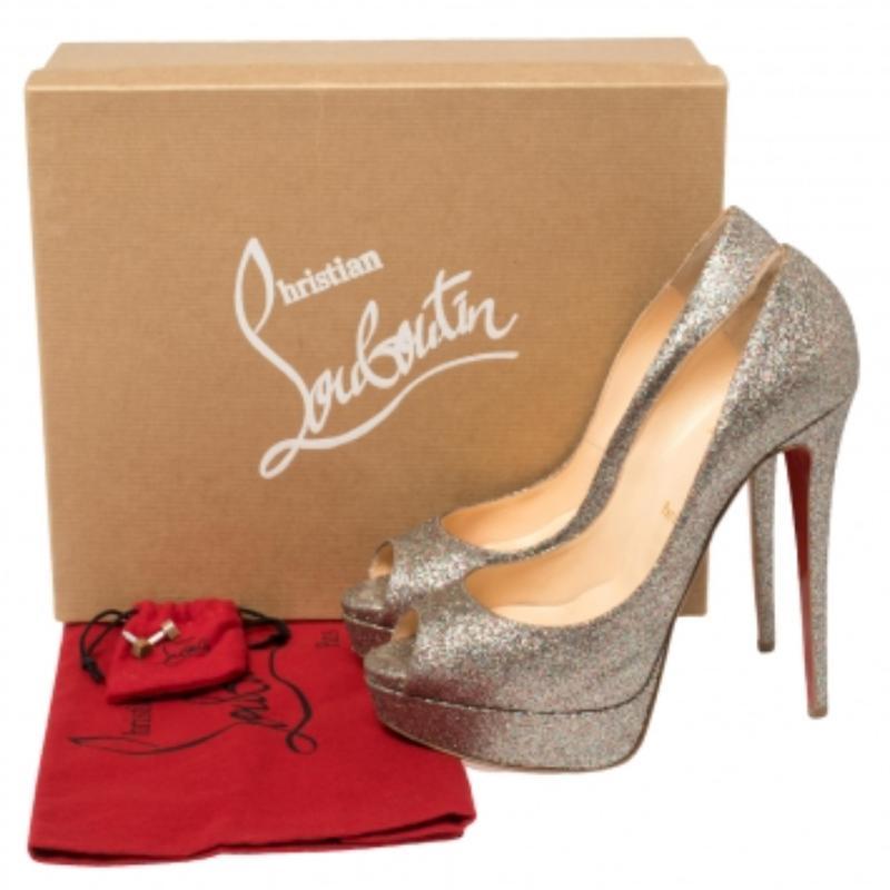 Stand out from a crowd with this gorgeous pair of Louboutins that exude high fashion with class! Crafted from glitter fabric, this is a creation from their Lady Peep collection. They feature peep toes and a shimmery exterior. Completed with leather