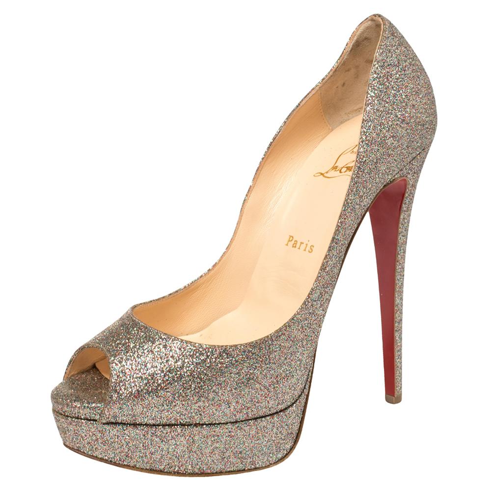 Stand out from a crowd with this gorgeous pair of Louboutins that exude high fashion with class! Crafted from glitter fabric, this is a creation from their Lady Peep collection. They feature peep toes and a shimmery exterior. Completed with leather