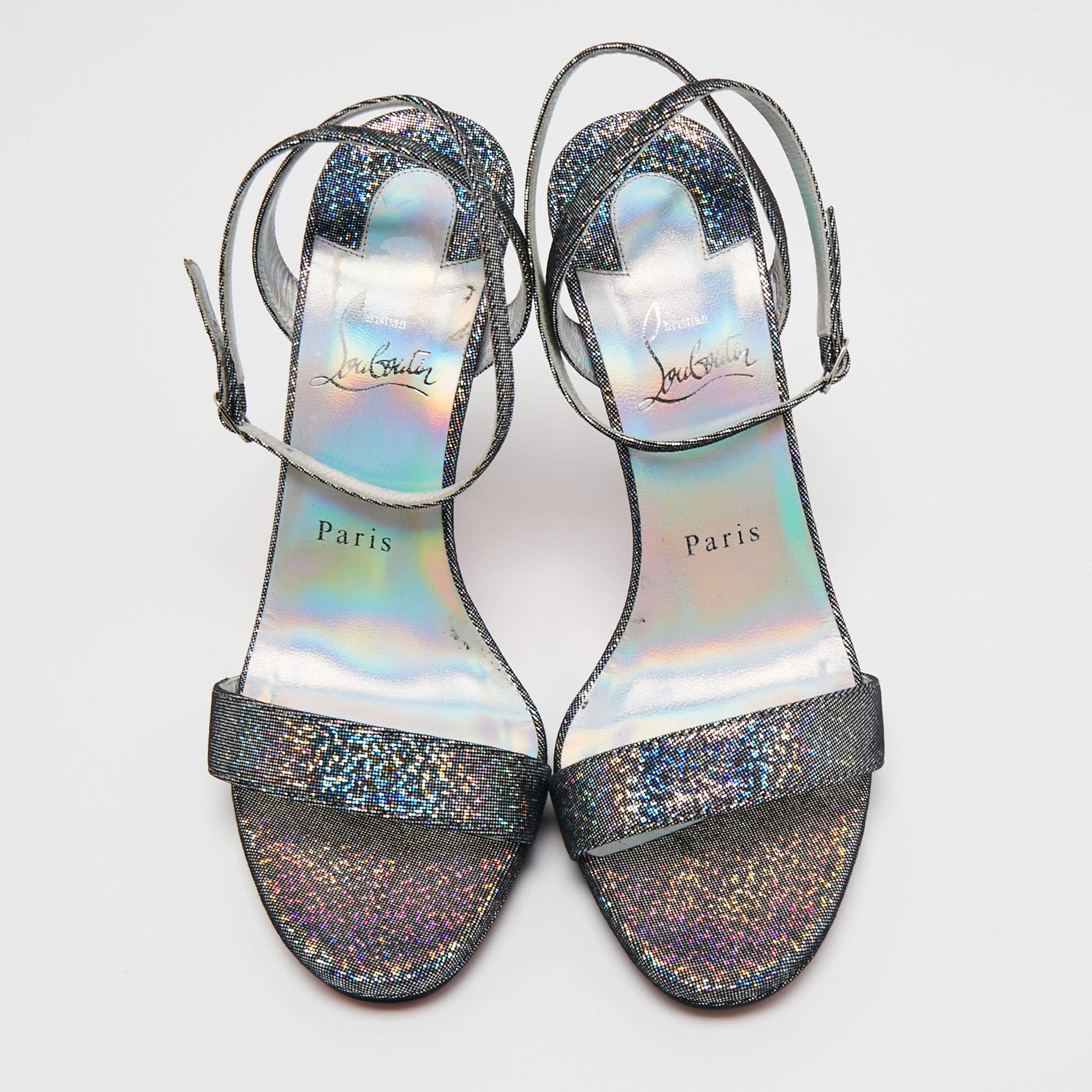To perfectly complement your party outfits, Christian Louboutin brings you this pair of sandals that speak nothing but high fashion. They've been crafted from multicolored glitter and are detailed with buckled ankle straps. The 12 cm heels are just