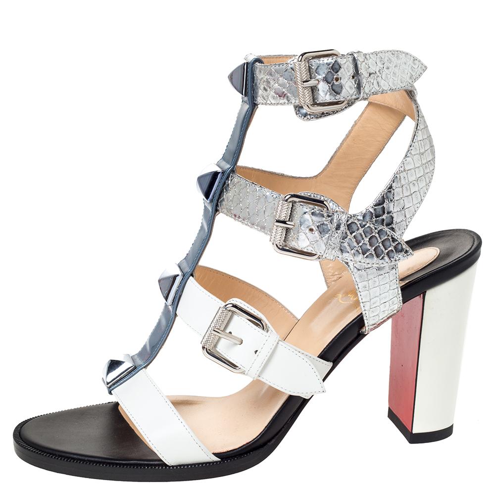 These stunning sandals by Christian Louboutin will make your outfits shine bright with style and glamour. Crafted from a combination of leather, patent leather and embossed leather, they carry lovely multicolored hues. They are styled with open