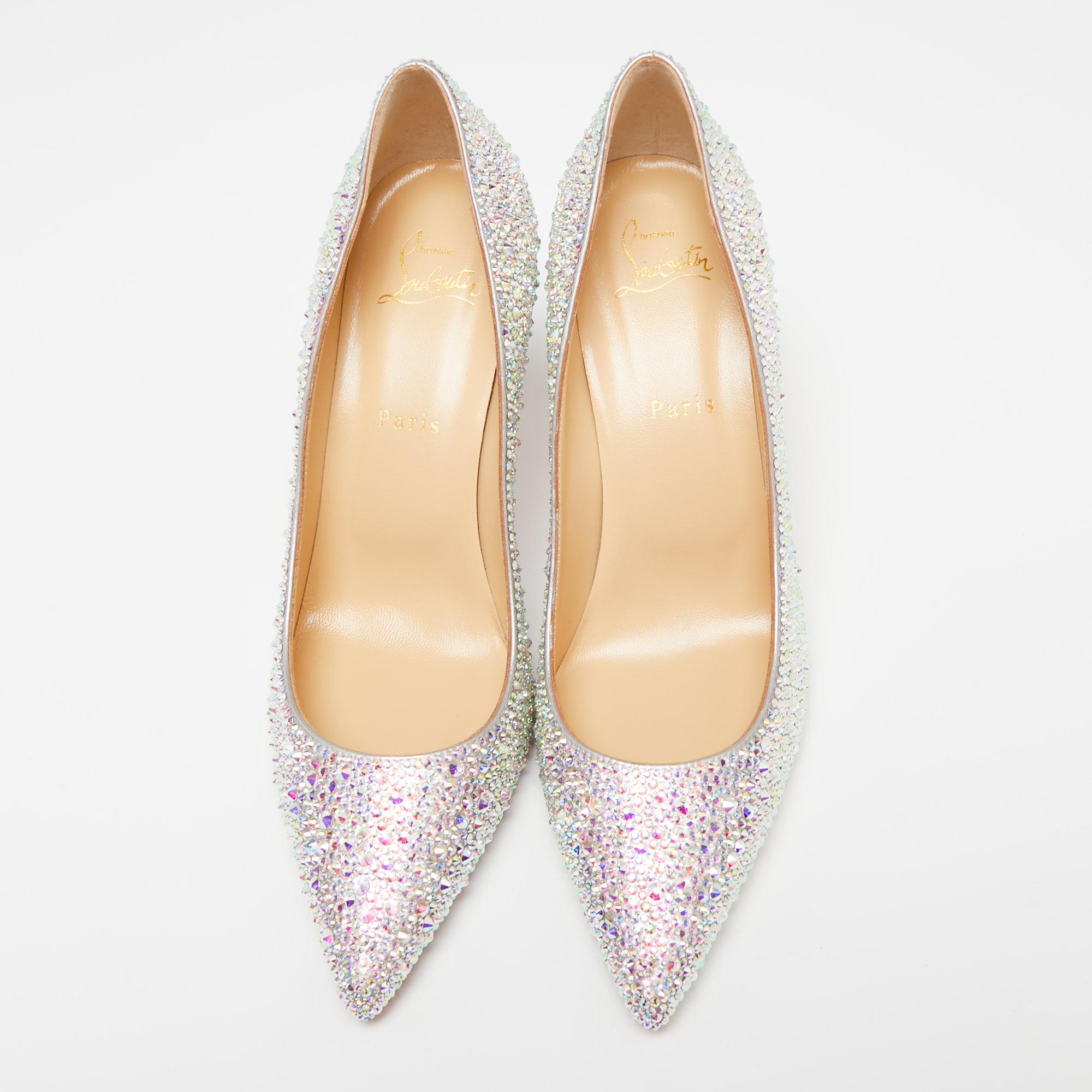 One of Christian Louboutin's most loved styles is the Kate pumps. These here are crafted in leather, flaunting a beautiful multicolored exterior with shimmering studs all over, pointed toes, and 8.5 cm high heels that create a stunning