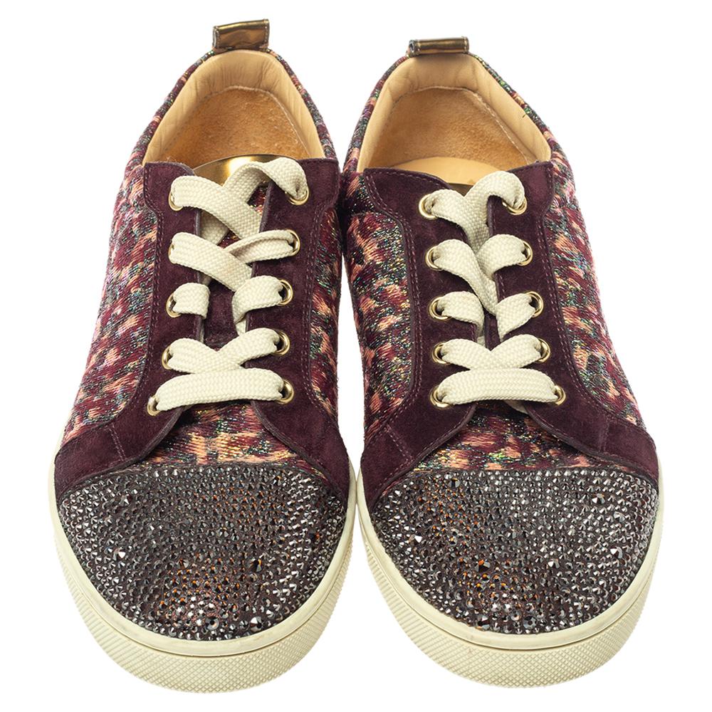 Christian Louboutin’s timeless glamour is applied to these trainers that have multiple hues. They’re made from suede and lurex with a round toe cap embellished with studs and lace-up front. They can be worn as an alternative to heels with tailored