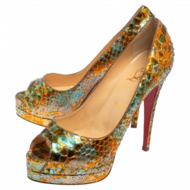 Stand out from the crowd with this gorgeous pair of Louboutins that exude high fashion with class! Crafted from python, they feature multiple hues with peep toes and a scaled exterior. Completed with leather insoles, stiletto heels, and signature