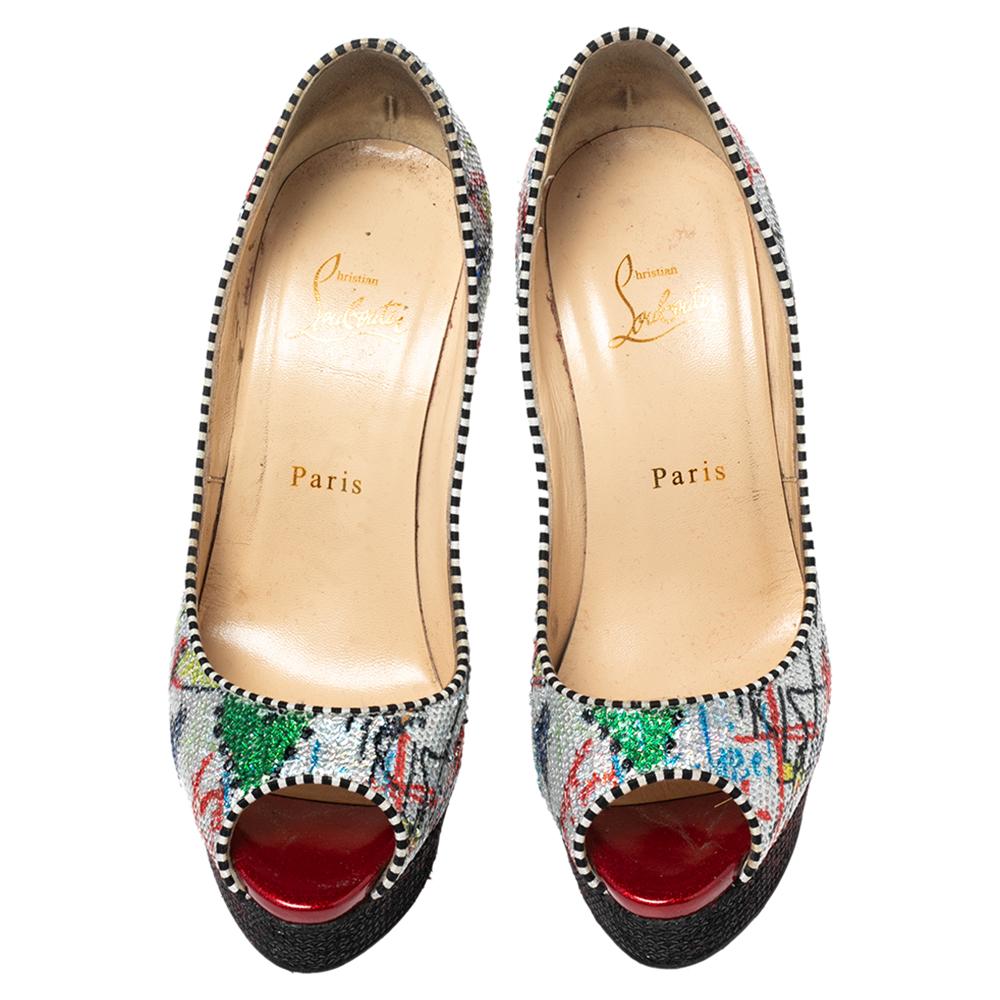 Dazzle everyone as you walk in these beautiful Fetish pumps from the House of Christian Louboutin. They are made from multicolored sequins fabric on the exterior and flaunt peep-toes, platforms, and super-slim heels. For a signature touch, they come
