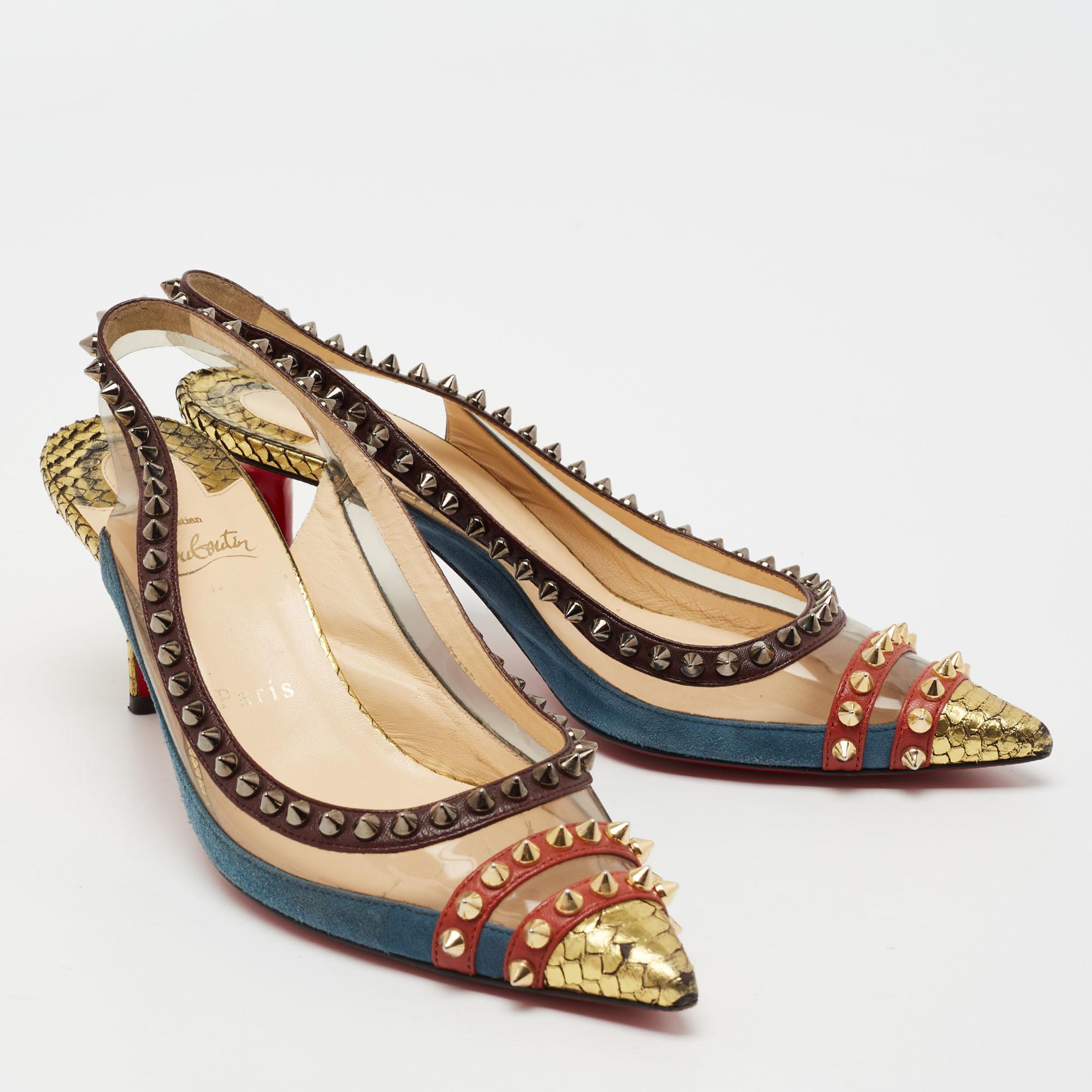 Slip into these statement Christian Louboutin pumps and add grace to your strides. Crafted from suede, these multicolored slingbacks are accented with PVC trims for a minimal look. With pointed toes, fabulous spike detailing all around, and