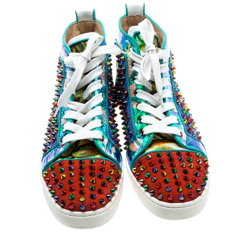 These Christian Louboutin's Louis sneakers are designed in a multicolored leather body with suede panels and feature trendy spikes detail all over for a bold look. Set on a rubber sole, this pair features contrasting lace-ups and comfortable insoles