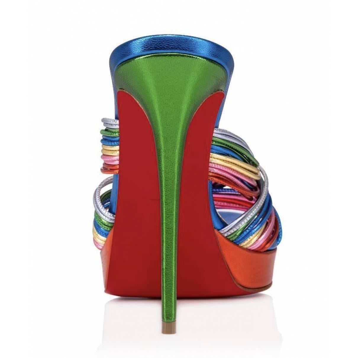 Multicolored leather mules from Christian Louboutin. The Multitaski mule pumps is made of goat leather, anchored together with a flurry of multicolored straps that are artfully knotted together, mounted on a slim 120 mm heel. Brand new, never worn.