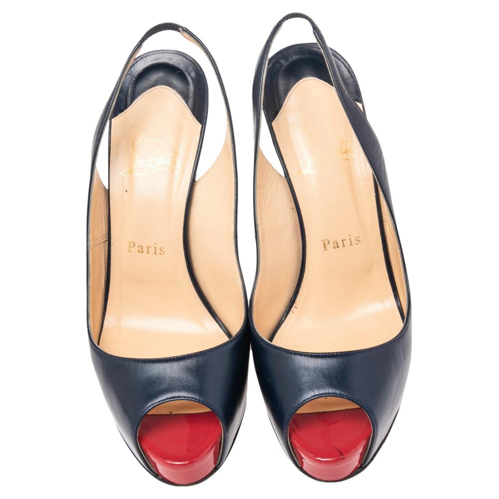 A navy blue shade greets you in these slingback sandals from Christian Louboutin. They come crafted from leather and feature a peep-toe silhouette. They are sure to offer you a lot of comfort with their leather-lined insoles and will lift you up