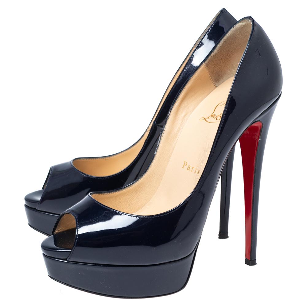 Trade in your basic black pumps for these exquisite and beautifully crafted Altadamaones in navy blue by Christian Louboutin. These stunning pumps are made from gorgeous patent leather and feature rounded peep toes, sky high 14 cm heels and