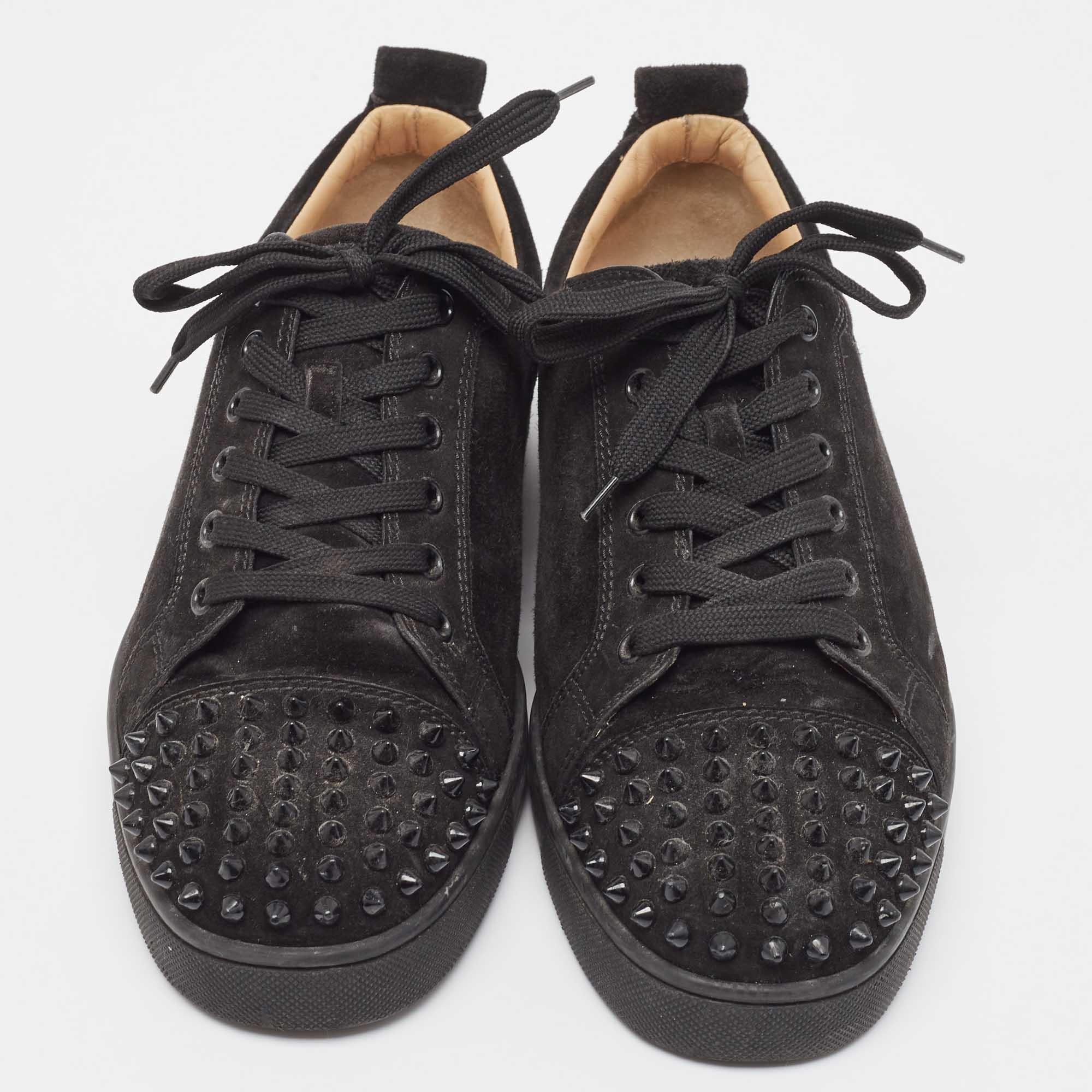 Add a statement appeal to your outfit with these Christian Louboutin sneakers. Made from premium materials, they feature lace-up vamps, spike details, and relaxing footbeds. The rubber sole of this pair aims to provide you with everyday