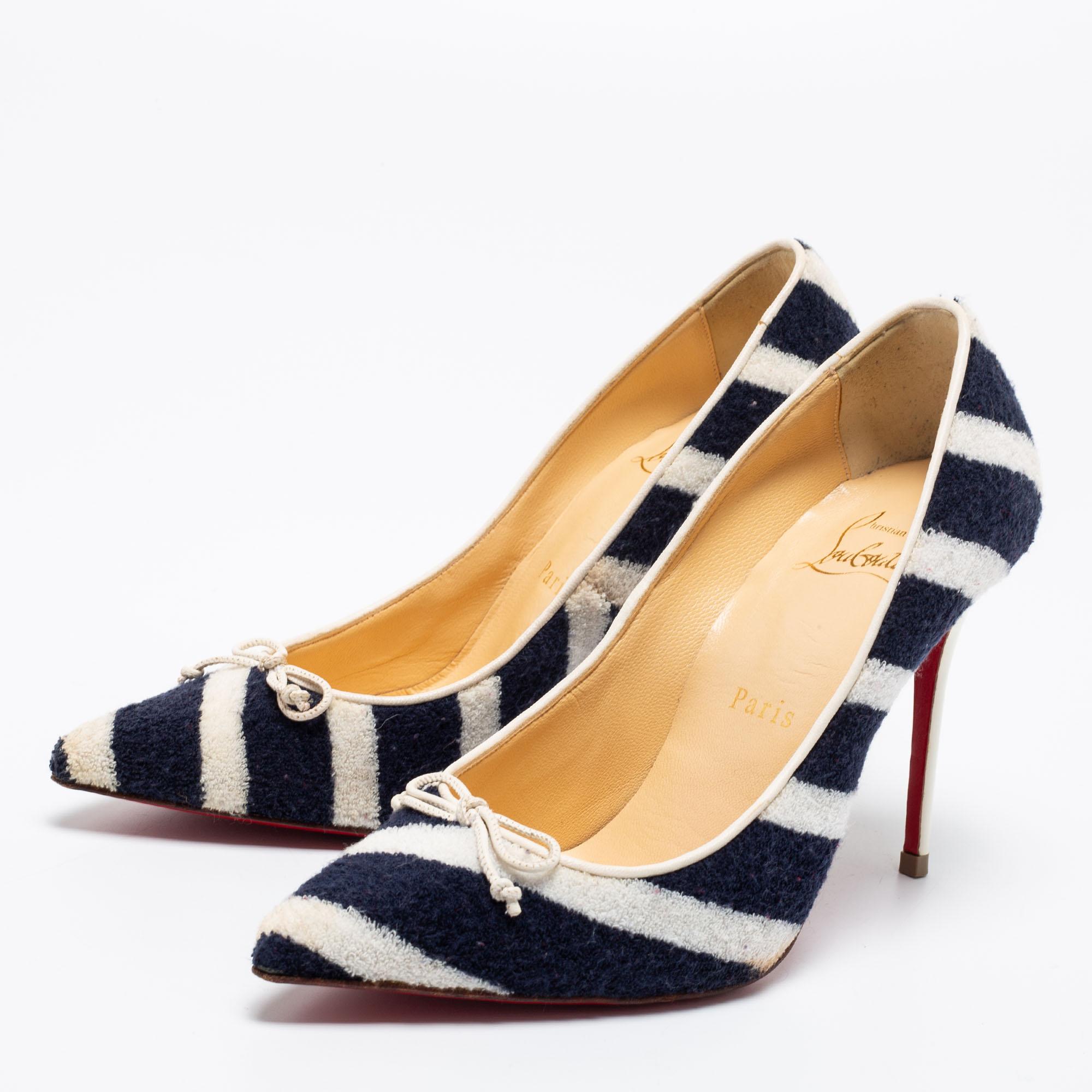 Project an elegant take in a comfortable manner with these timeless pumps by Christian Louboutin. Crafted fabric in navy blue and white stripes, they feature pointed toes and 9.5 cm heels.

Includes:
Original Dustbag, Original Box