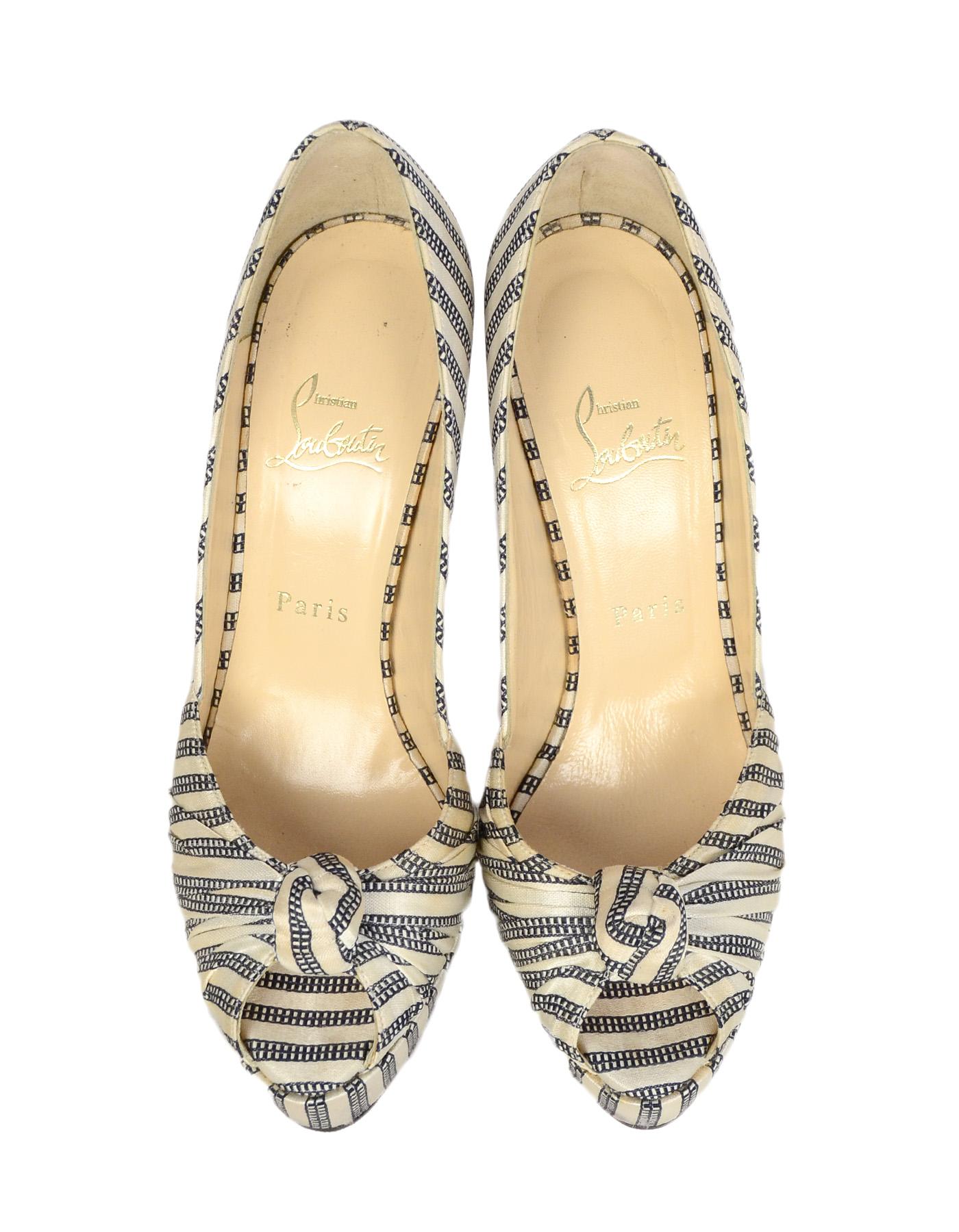 Christian Louboutin Navy/White Satin Stripe Greissimo 140 Peep Toe Knot Pumps sz 39.5

Made In: Italy
Color: Navy blue and ivory satin
Hardware: None
Materials: Satin & leather
Closure/Opening: Slide on 
Overall Condition: Very good.  Slight