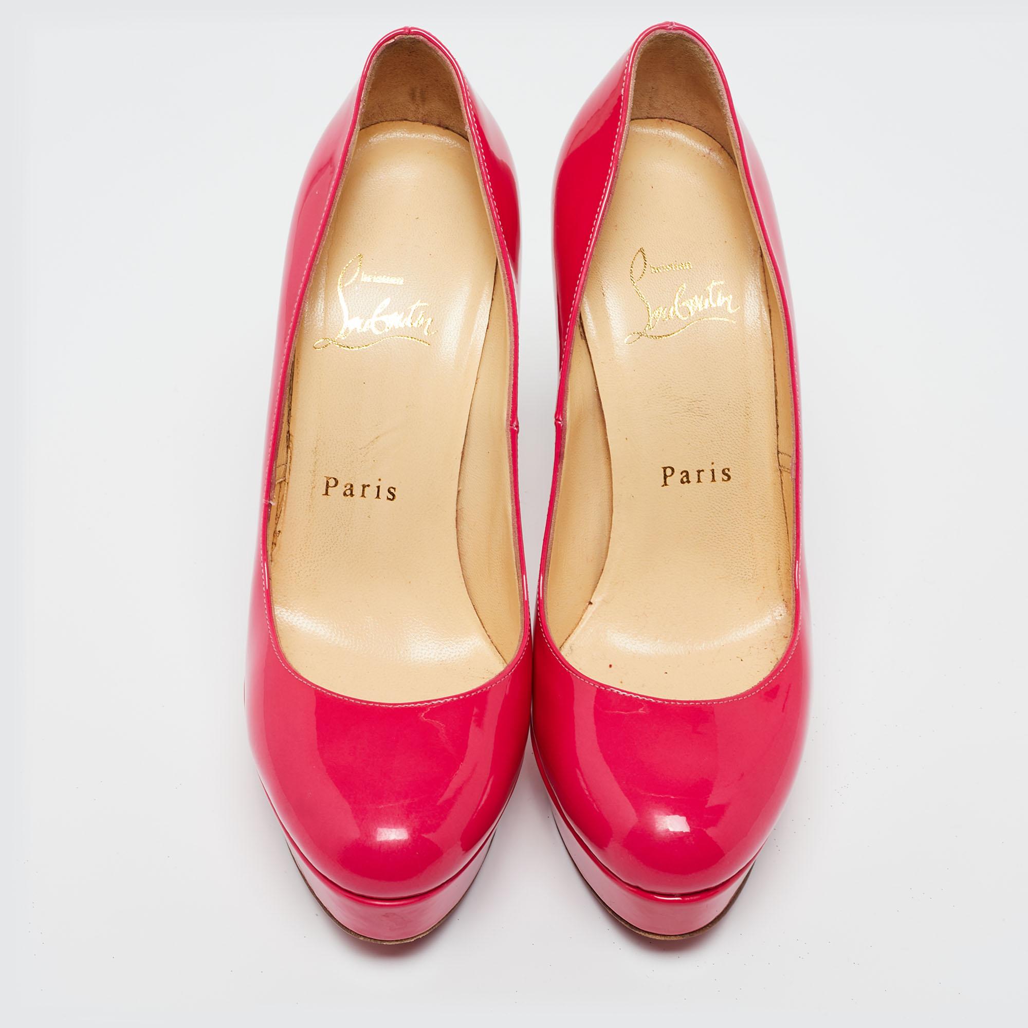 A classic to add to one's shoe collection is this pair. These Christian Louboutin beauties are covered in patent leather and styled with platforms, 12.5 cm heels, and signature red soles. Add these neon pink CL pumps to your closet today!

Includes: