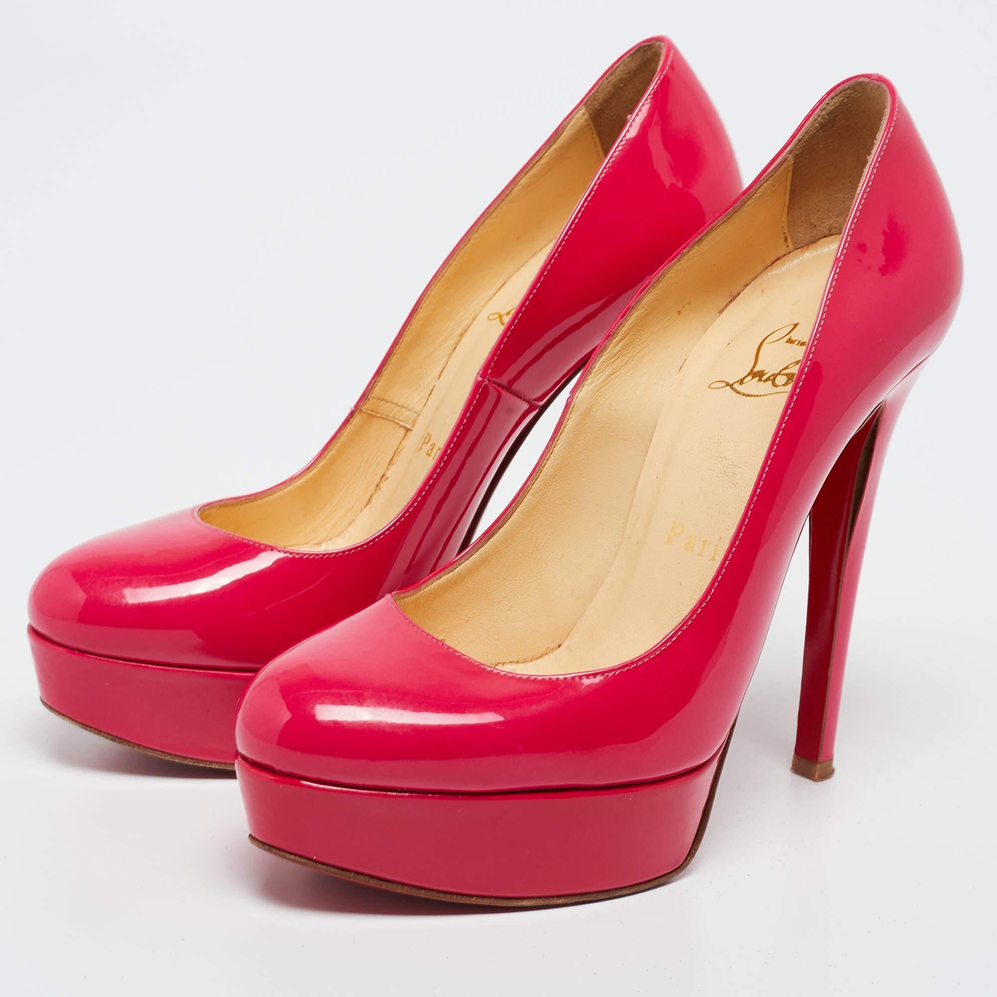 A classic to add to one's shoe collection is this pair. These Christian Louboutin beauties are covered in patent leather and styled with platforms, 12.5 cm heels, and signature red soles. Add these neon pink CL pumps to your closet today!

