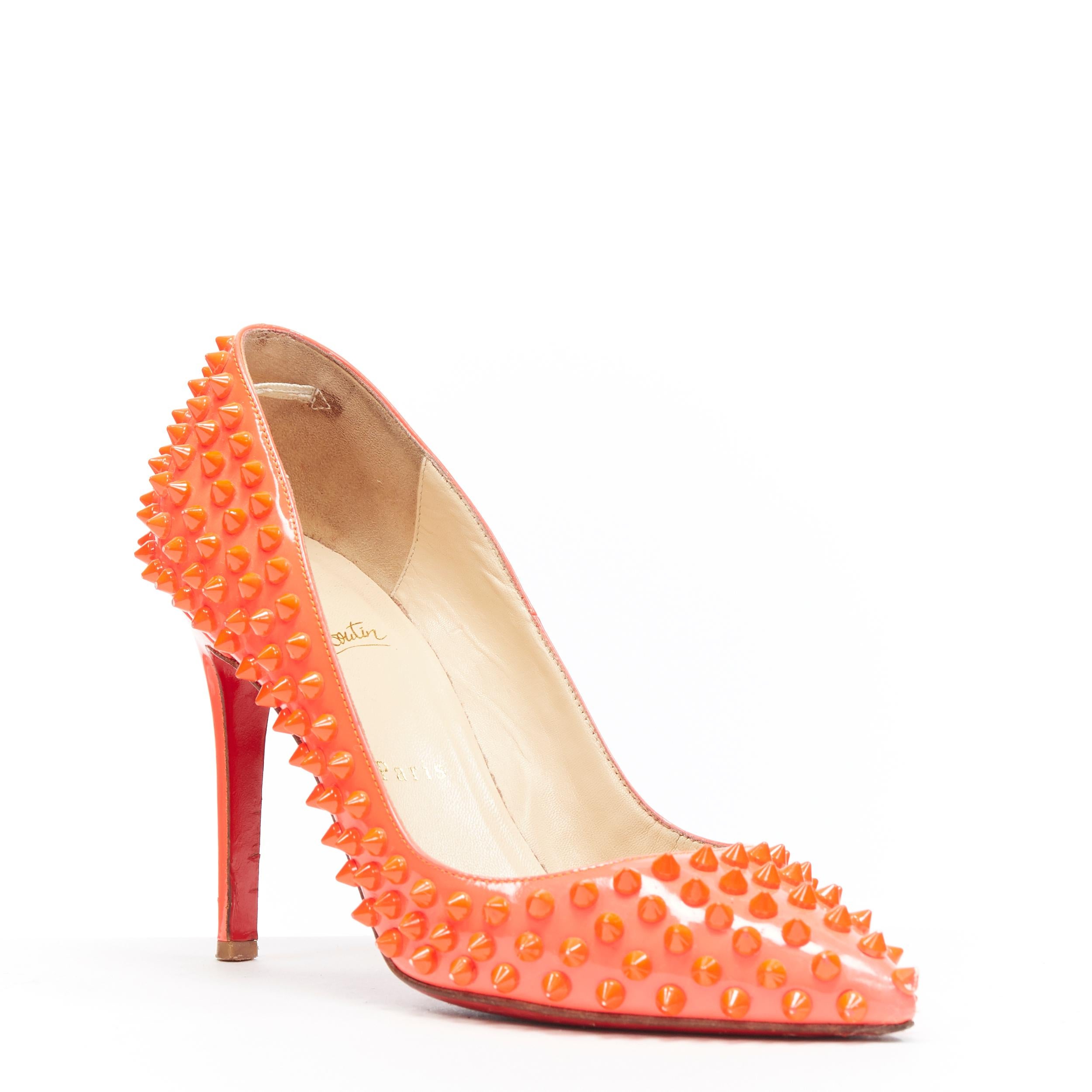 CHRISTIAN LOUBOUTIN neon pink patent spike stud point toe pigalle pump EU37.5 
Brand: Christian Louboutin
Designer: Christian Louboutin
Model Name / Style: Spike pump
Material: Patent leather
Color: Pink
Pattern: Solid
Lining material: Leather
Extra
