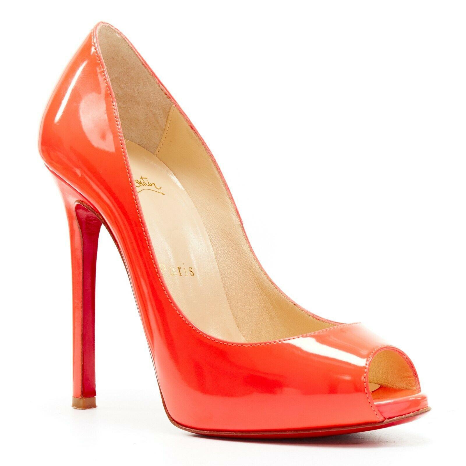 CHRISTIAN LOUBOUTIN neon shocking pink patent peep toe platform heel EU35.5
CHRISTIAN LOUBOUTIN
Shock pink neon patent leather upper. 
Tonal stitching. 
Peep toe. 
Concealed platform sole. 
Slim high heel. 
Covered heel. 
Padded tan leather lining.