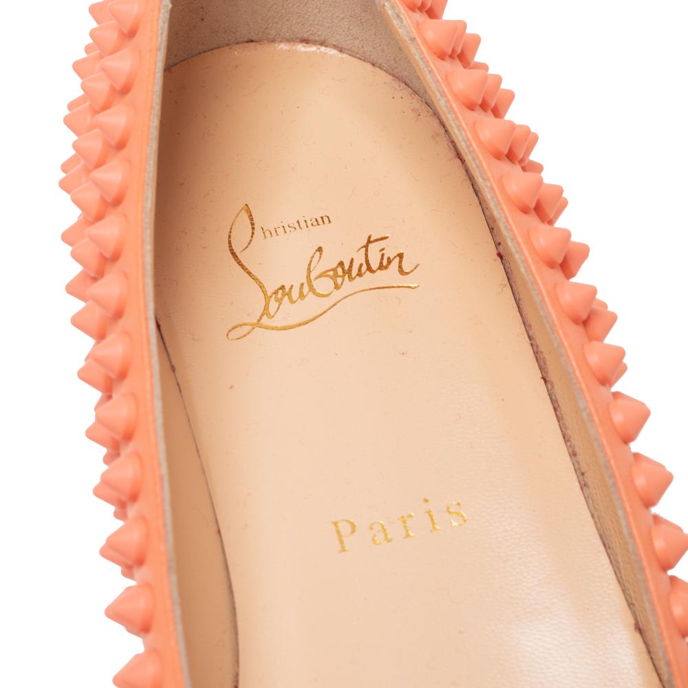 These ballet flats from Christian Louboutin grab every eyeball that is present around! Crafted from leather, these orange flats feature pointed toes and matching spikes throughout. They have signature red soles and leather-lined insoles.

Includes: