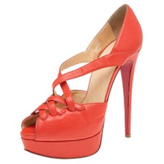 Christian Louboutin Orangefarbene Plateausandalen aus Leder Größe 38