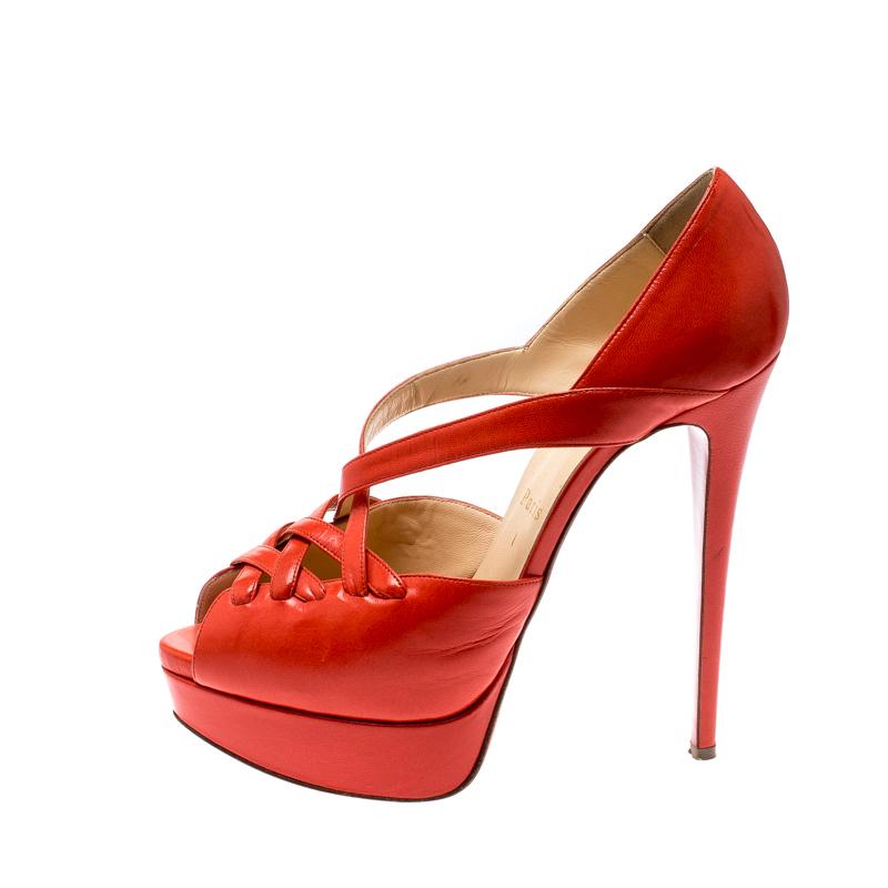 You'll be all set to shine with style in these dazzling sandals from Christian Louboutin. They are crafted from leather and designed with crisscross straps, platforms and 14.5 cm heels. Complete with the signature red touch on the soles, these