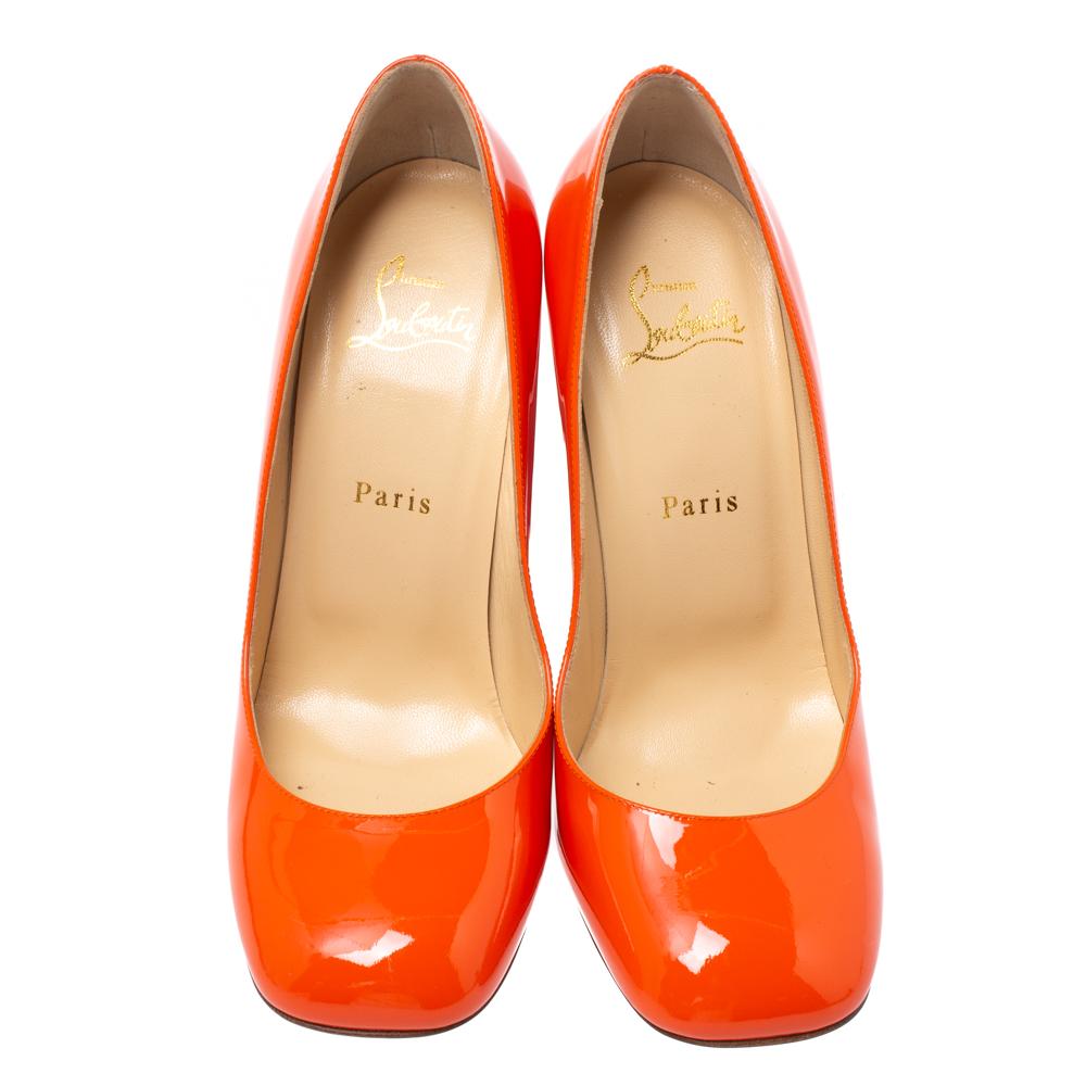 Now here is one pair you'll definitely love wearing! These orange pumps from Christian Louboutin impress with their patent leather construction, square toes and 11 cm block heels. They'll make your feet happy with their comfortable leather-lined