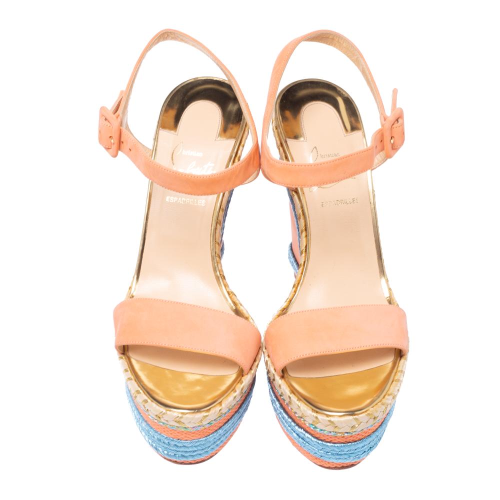 Embrace your love for fashion in a whole new way with these lovely sandals from Christain Louboutin! They come crafted from pale orange leather and feature an open toe silhouette. They are styled with single vamp straps, ankle straps with buckle
