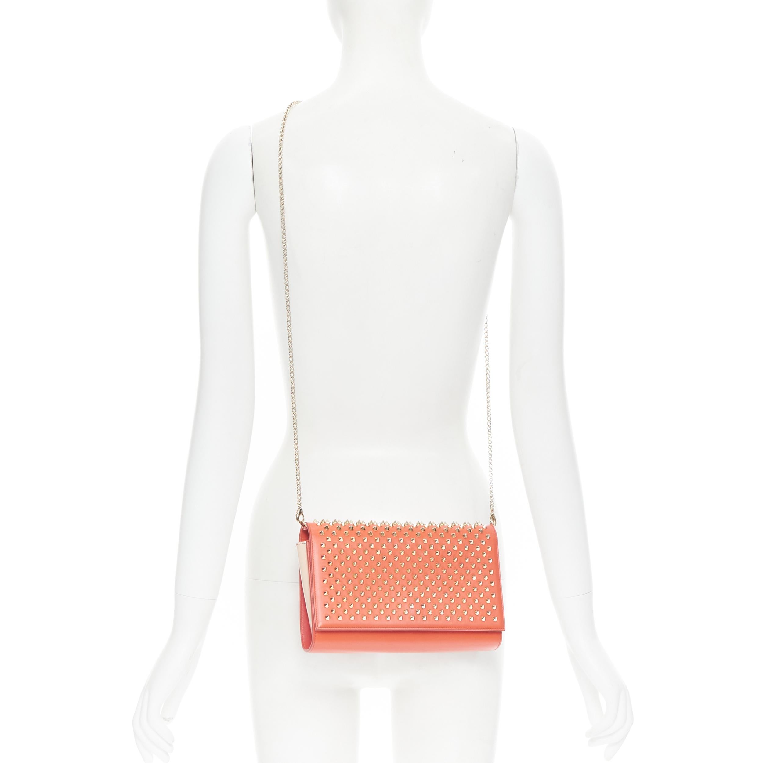 CHRISTIAN LOUBOUTIN Paloma red gold spike stud pink gusset shoulder chain bag 
Reference: TGAS/B01025 
Brand: Christian Louboutin 
Designer: Christian Louboutin 
Model: Paloma clutch 
Material: Leather 
Color: Red 
Pattern: Solid 
Closure: Button