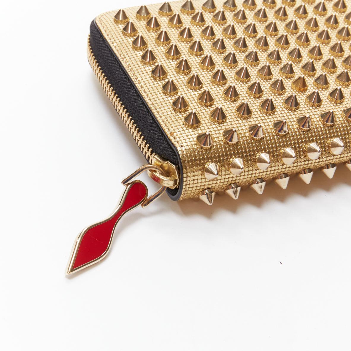 CHRISTIAN LOUBOUTIN Panettone gold studded leather zip around long wallet
Reference: TGAS/D00652
Brand: Christian louboutin
Material: Leather
Color: Gold
Pattern: Solid
Closure: Zip
Lining: Red Leather
Extra Details: Zip-around fastening, metallic