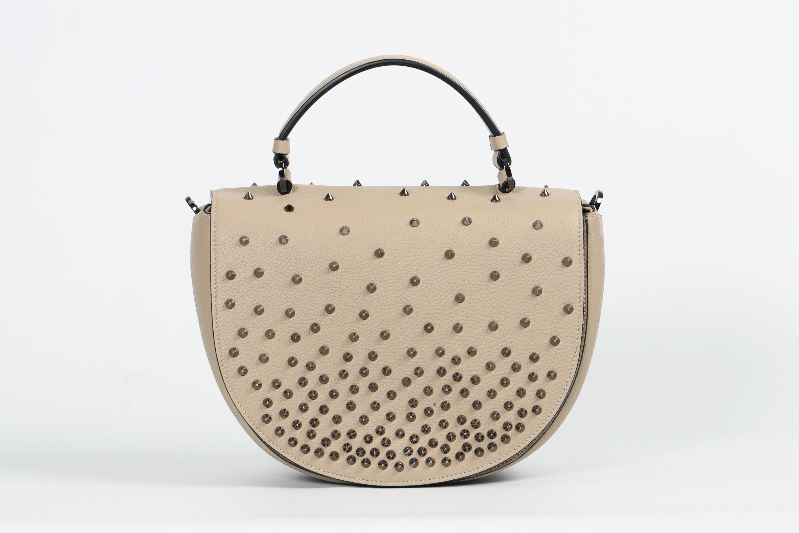 <ul>
<li>Christian Louboutin Panettone Spiked Leather Shoulder Bag.</li>
<li>Beige.</li>
<li>Magnetic fastening - Top.</li>
<li>Comes with - dustbag and box.</li>
<li><strong>Model: Panettone.</strong></li>
<li><strong>Height: 8