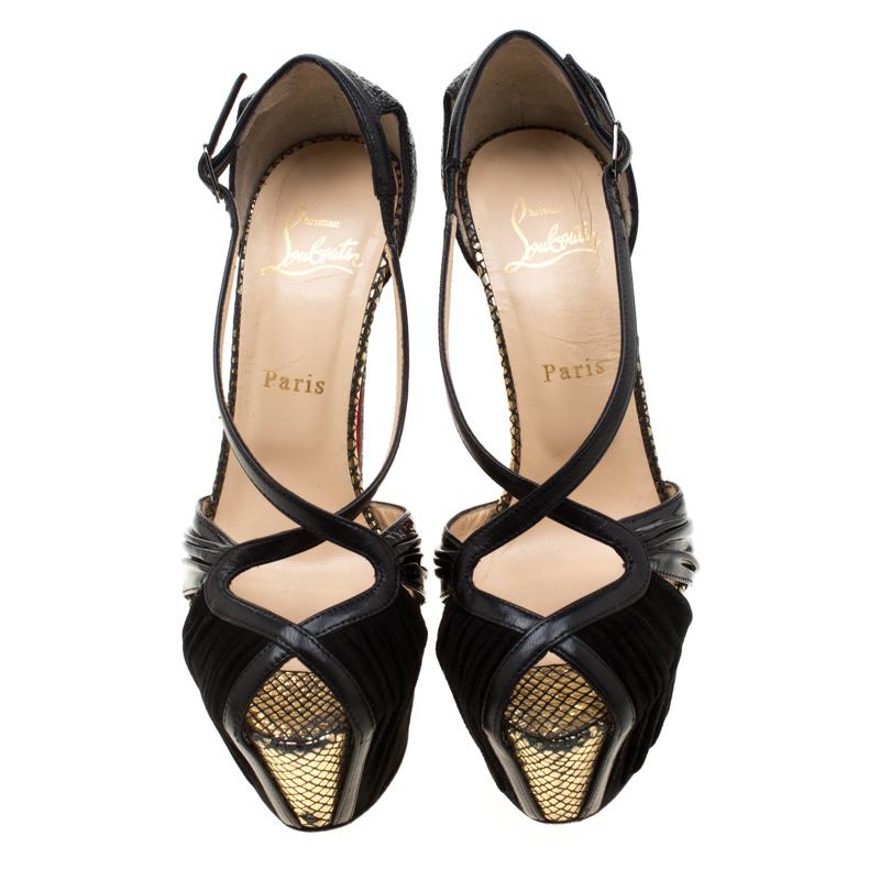 Keep it casual and chic with these sandals crafted from a combination of suede, patent leather and python-embossed leather trims. Stay stylish on your next evening out in these sandals which come with a leather sole and vertiginous stiletto heels.