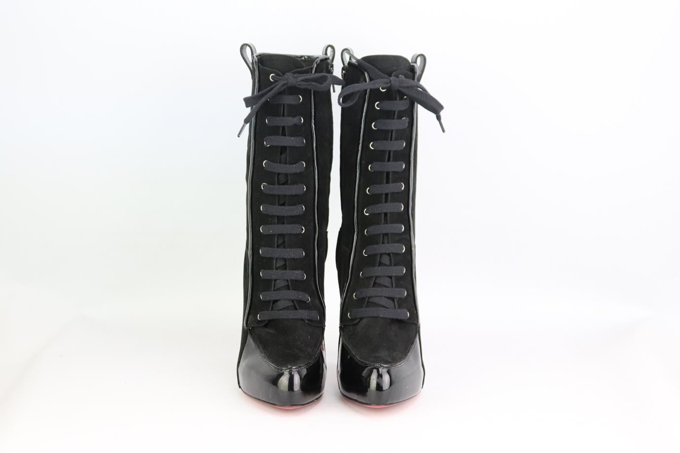 Christian Louboutin patent leather and suede platform boots. Made from black suede and patent leather with sexy lace-up fastening and striking heel with the brand’s iconic red sole. Black. Lace up fastening at front. Does not come with box or