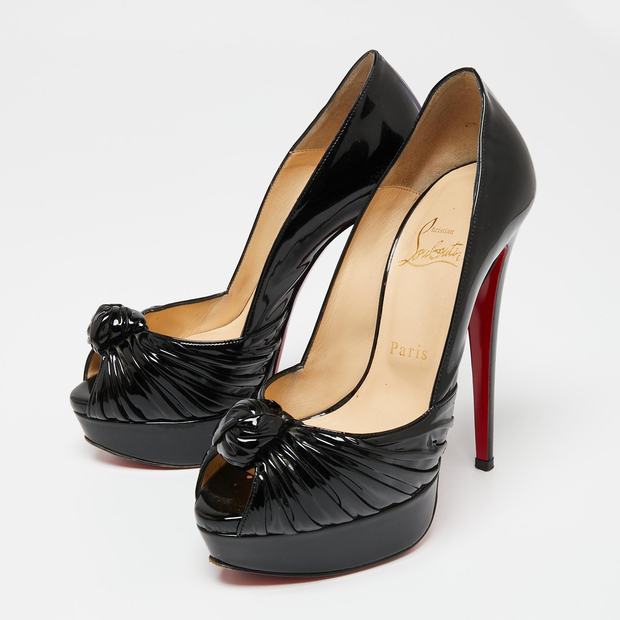 Add a dose of femininity to your look with this charming pair of pumps from Christian Louboutin. Made in patent leather, the pair features a low-cut vamp, 14 cm tall heels, smooth leather lining, and red insoles. Finished with knots on the uppers,
