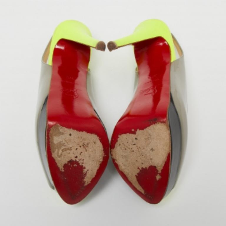 Stand out from the crowd with this gorgeous pair of Louboutins that exude high fashion with class! Crafted from patent leather, they feature three colors and a glossy exterior. Completed with peep-toes, leather insoles, high heels, and signature red