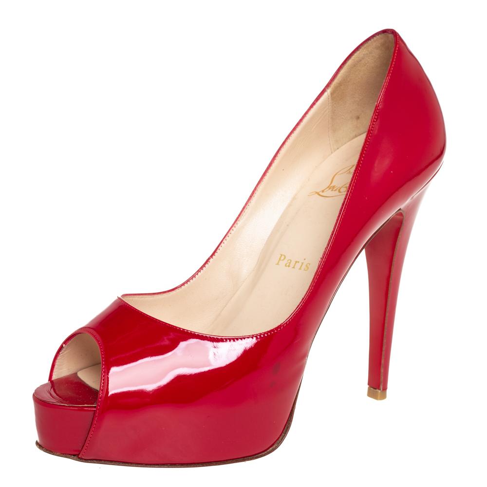This red pair of Christian Louboutin pumps is a timeless classic. Step out in style while flaunting these patent leather shoes, ideal for all occasions. They feature peep toes, platforms, and 13 cm heels.

Includes: Original Dustbag