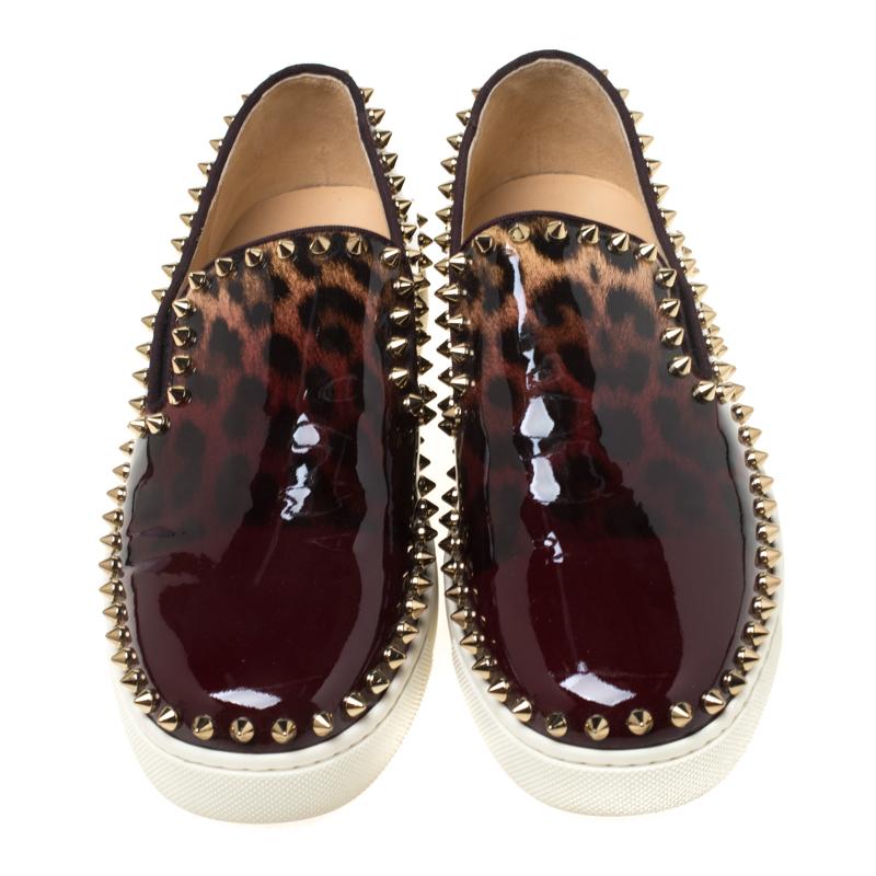 These slip-on loafers from Christian Louboutin are effortlessly suave and amazingly stylish! They come crafted from leopard printed patent leather and feature round toes and multiple spikes adorning the edges. They are equipped with comfortable