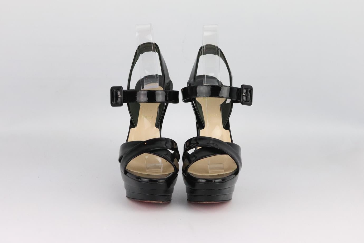 Christian Louboutin patent leather platform sandals. Made from black patent leather with crossover straps and set on the brand’s iconic red sole. Black. Buckle fastening at side. Does not come with box or dustbag. Size: EU 38 (UK 5, US 8). Insole: