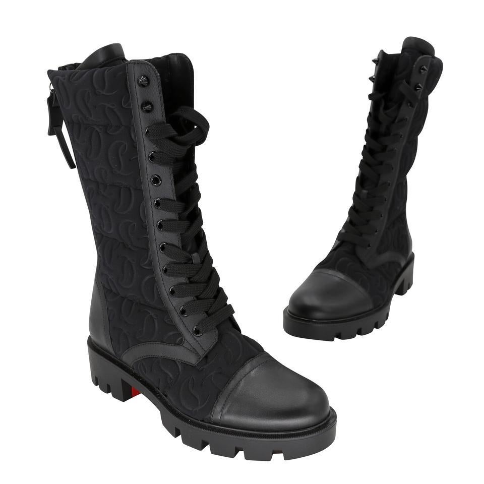 The Pavleta combat boots from Christian Louboutin feature monogram-debossed neoprene uppers and spiky studs on the back zippers for brand-typical flair. They're finished with exaggerated tongues and leather trims. These boots are completely
