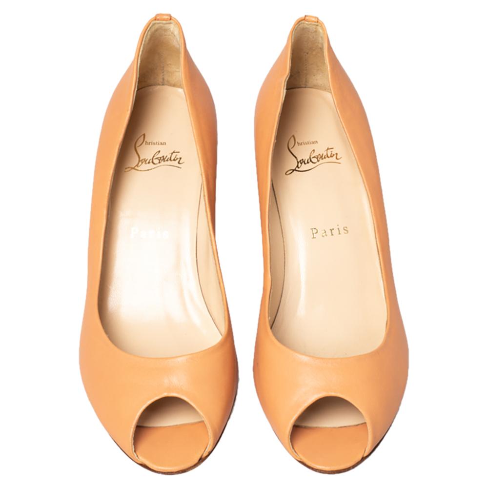 These pumps by Christian Louboutin carry a versatile design to complement various outfits. Crafted in peach leather, they feature peep toes and wedge heels. The insoles are leather-lined and the pair is complete with durable soles. Wear these with a