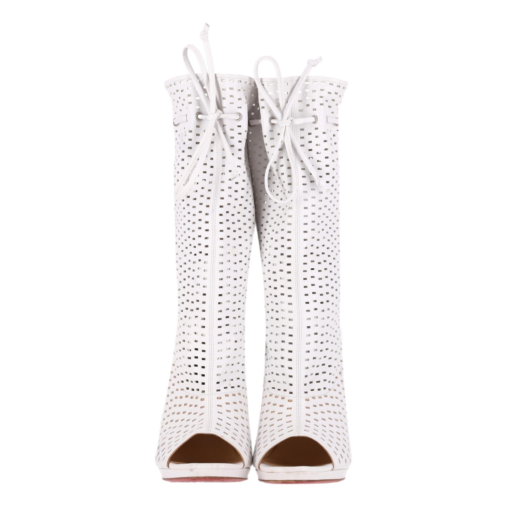 Christian Louboutin Perforated Leather 'Jennifer' Peep-Toe Boots

White 'Jennifer' boots crafted from perforated Nappa leather.

Featuring peep-toe and leather drawstring tie-up detail.

Designed with a high stiletto heel and the brand's signature