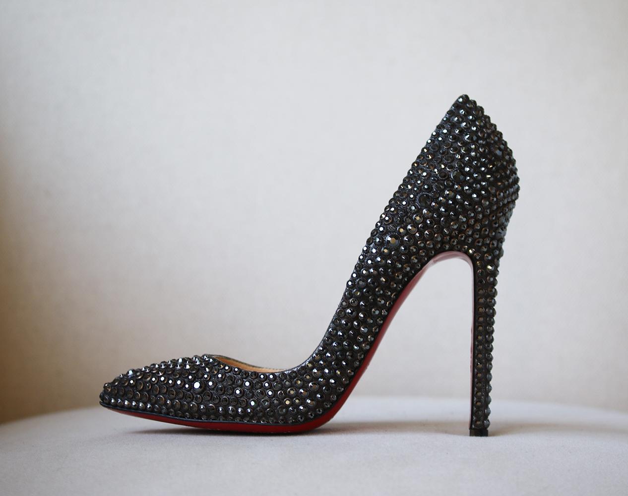 Christian Louboutin's 'Pigalle' pumps have become a cult classic among fashion's elite and the French designer gives his iconic style a hard-hitting makeover with this gunmetal suede version. Covered in gleaming crystals and finished with the