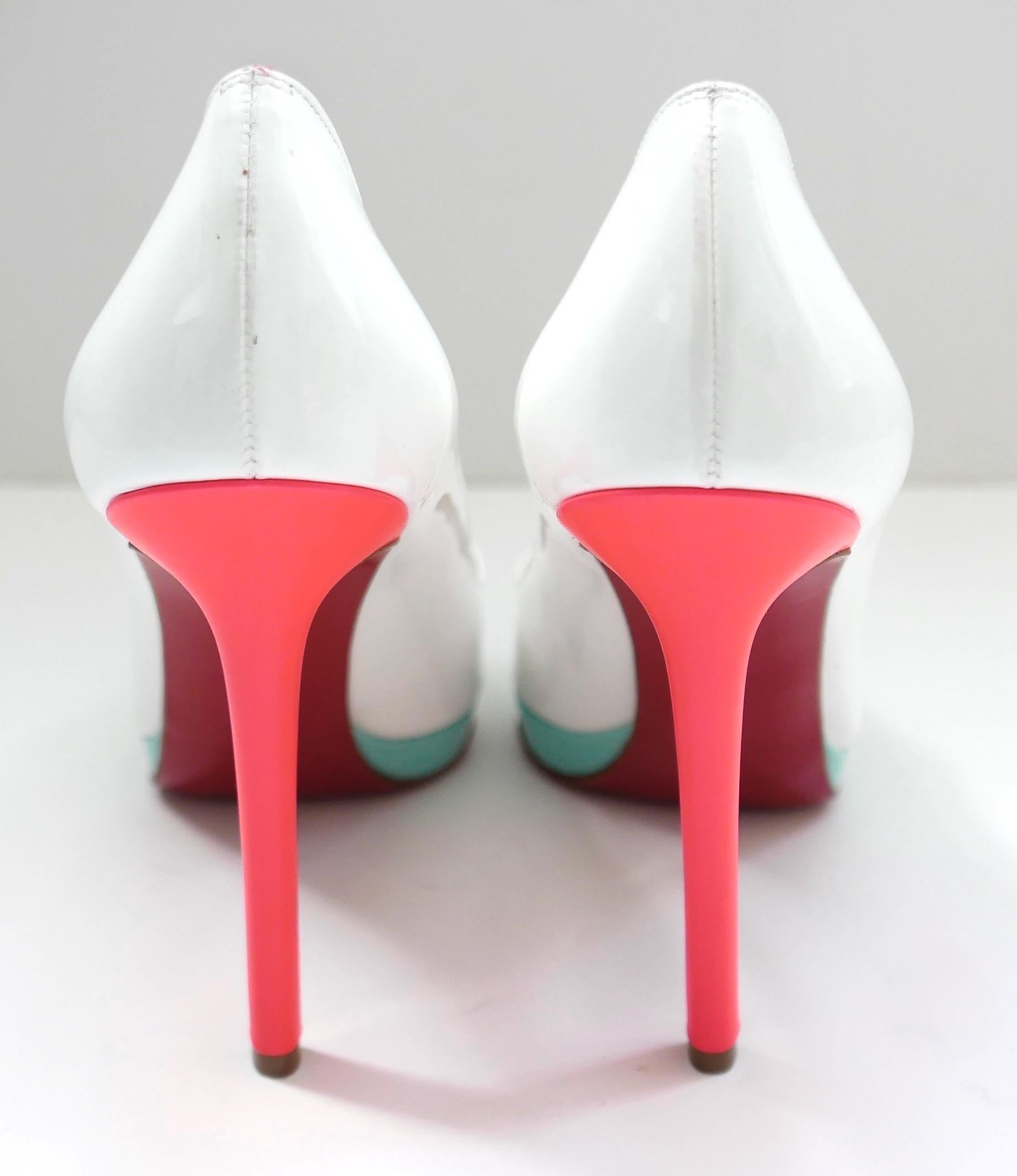 Super cool Christian Louboutin Pigalle Plato heels in white patent leather with neon pink heels and slim turquoise platform. Size 36.5. Measure approx - 10” heel to toe inside and heel is 4.5”. Unworn but do have a few marks form storage. Come with