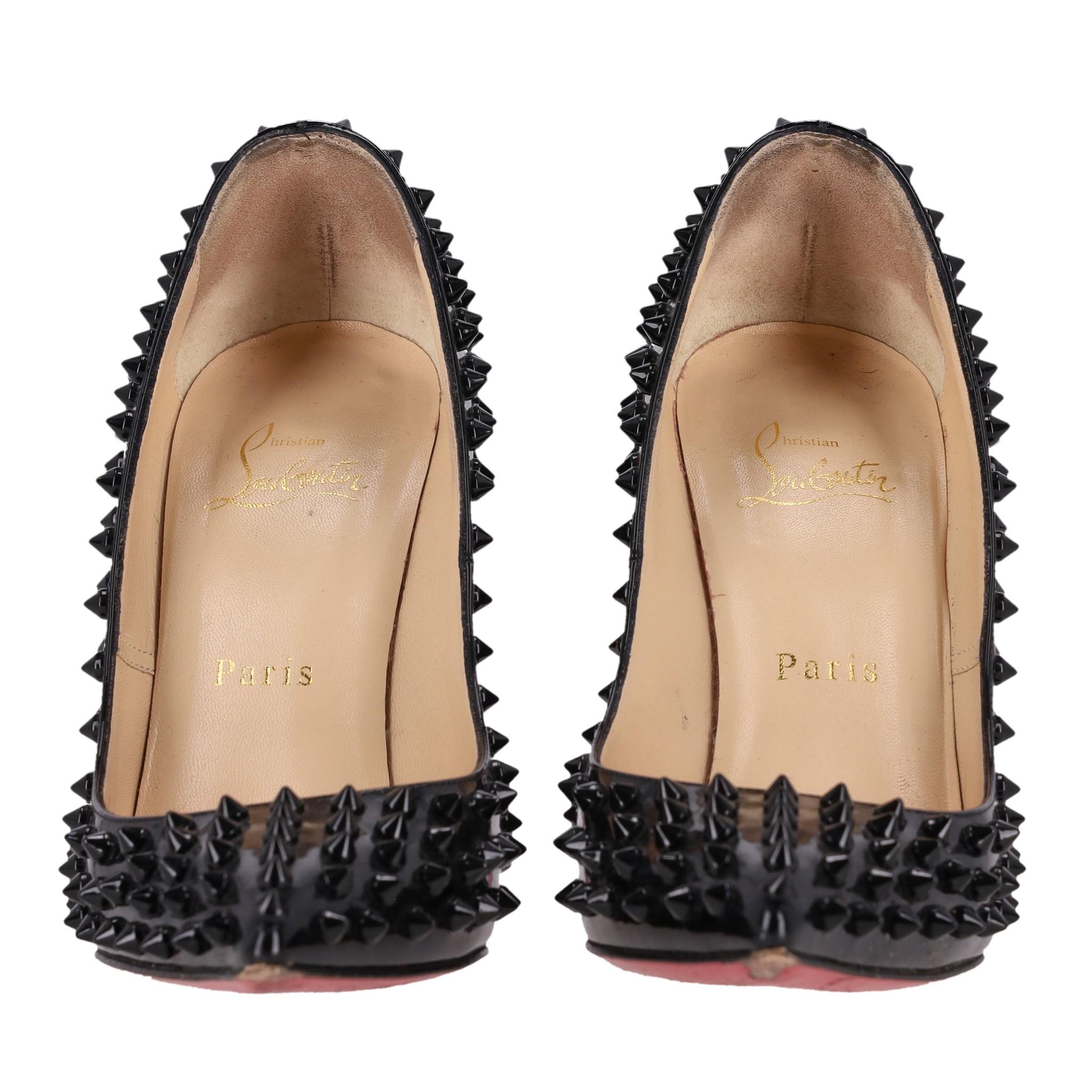 Christian Louboutin Pigalle Spikes Patent Leather Pumps

Black heels crafted from glossy patent leather, fully embellished with black spikes.

Featuring the brand's signature red soles, pointed toe and high stiletto heel.

Rrp Approx. £900

Size –