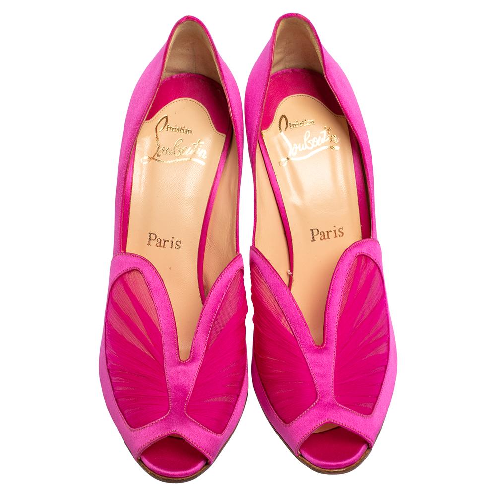Embrace feminity with these Christian Louboutin pumps. They are crafted from bright pink satin and are finished with beautifully designed crepe vamps. Accented with 11 cm high heels, the insoles are leather-lined and feature brand