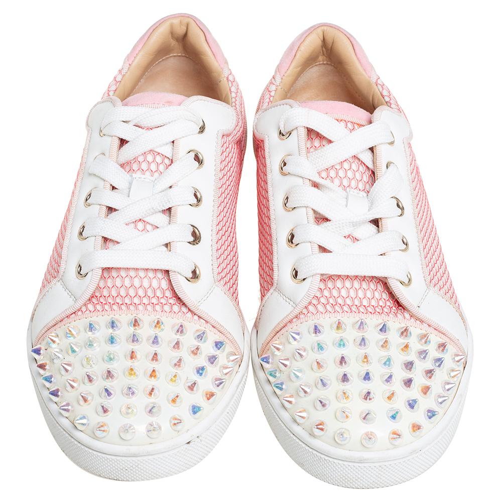 You'll leave your friends amazed every time you step out in these Louis Junior sneakers from Christian Louboutin! These pink sneakers are crafted from fabric and patent leather and feature round toes with multiple spikes detailed on them. They