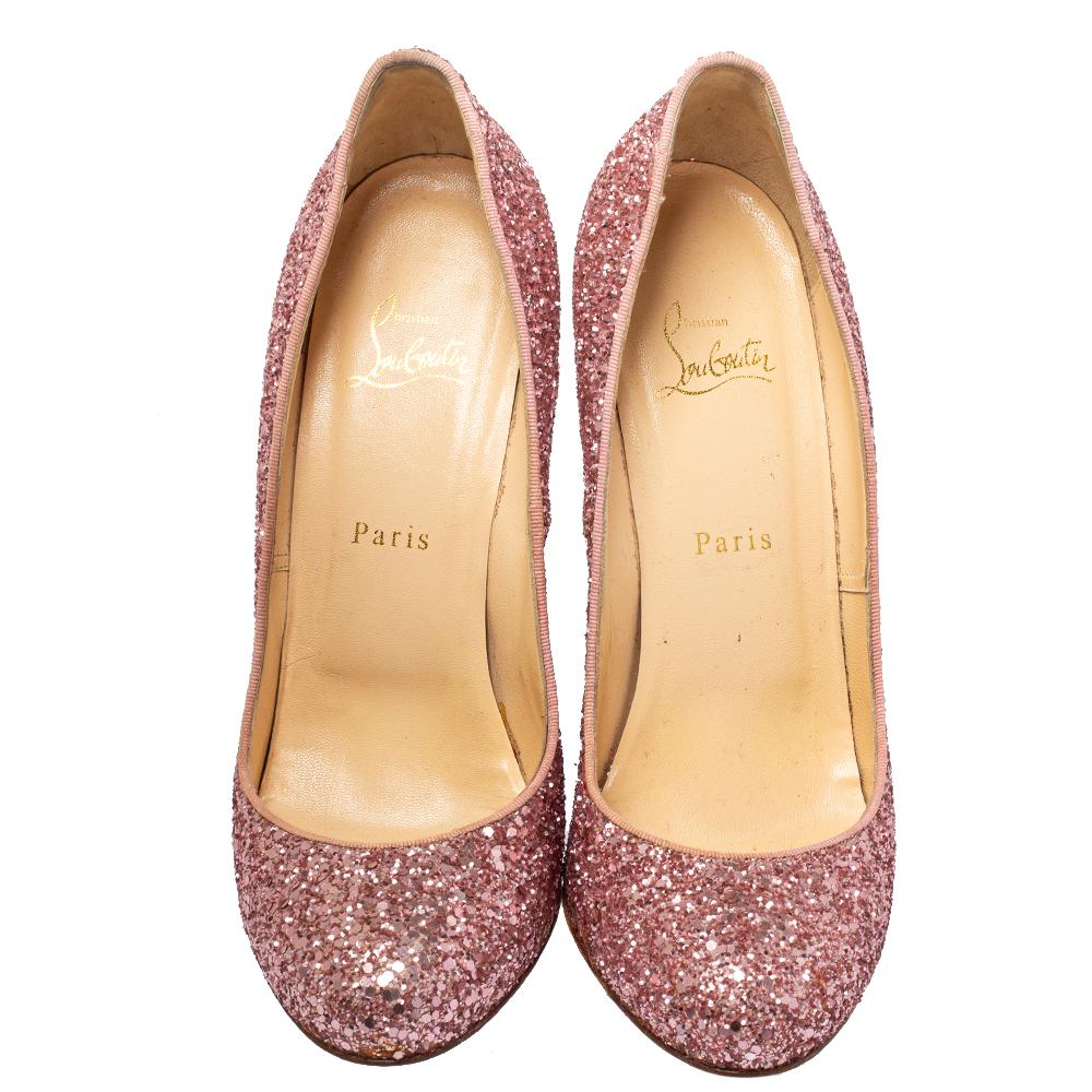 Every shoe collection is incomplete without a pair of dazzling pumps. These Christian Louboutin beauties have been created from glitter and styled with round toes, and 13 cm heels. The pumps also carry comfortable insoles and signature red soles.