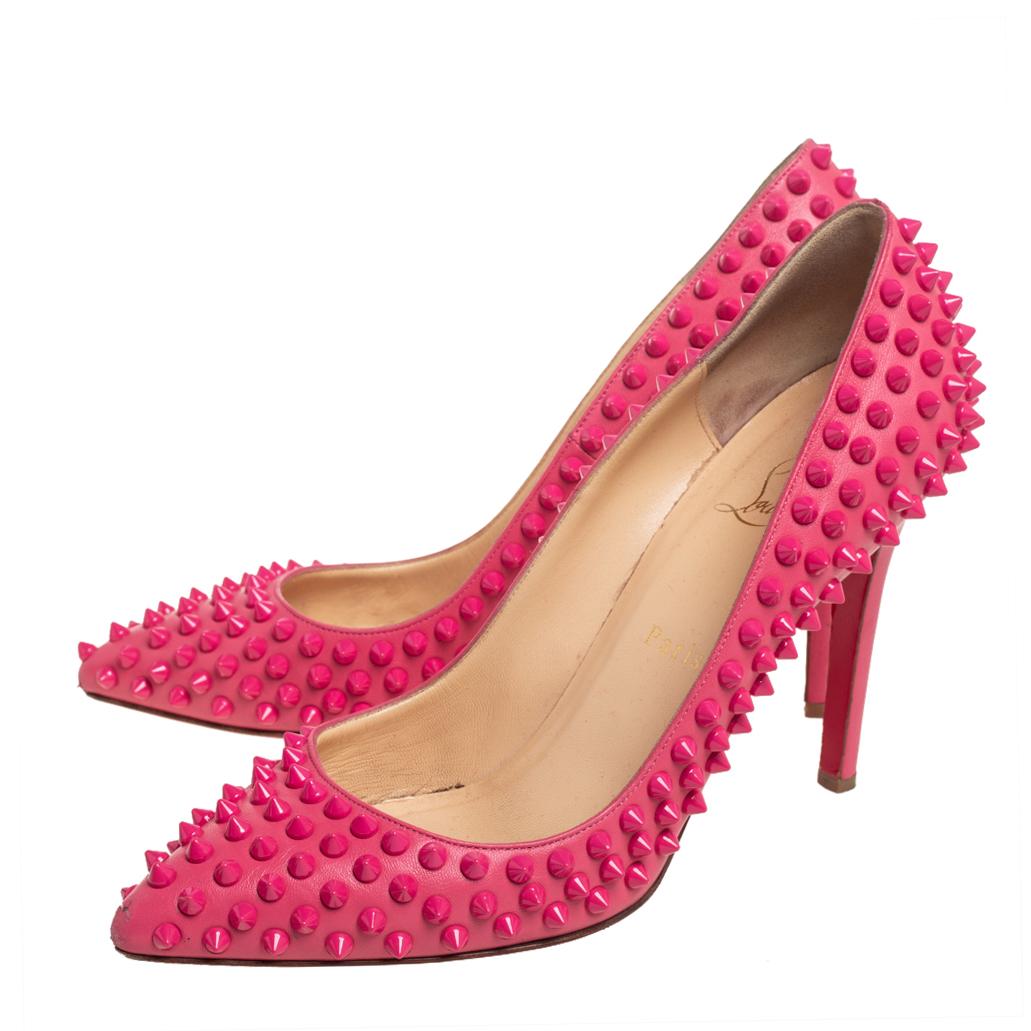 Dazzle everyone with these Louboutins by owning them today. Crafted from leather, these pink Pigalle pumps carry a mesmerizing shape with spike embellishments all over, pointed toes, and 10.5cm heels. Complete with the signature red soles, this pair