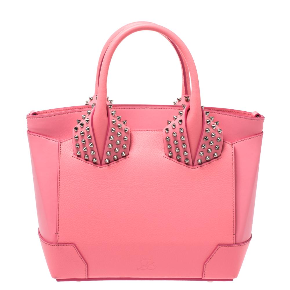 The Eloise by Christian Louboutin is praise to Italian craftsmanship. It features fine lines and a grand structure to delight women who believe in timeless glamour. This satchel comes made in pink leather accompanied by the signature element of