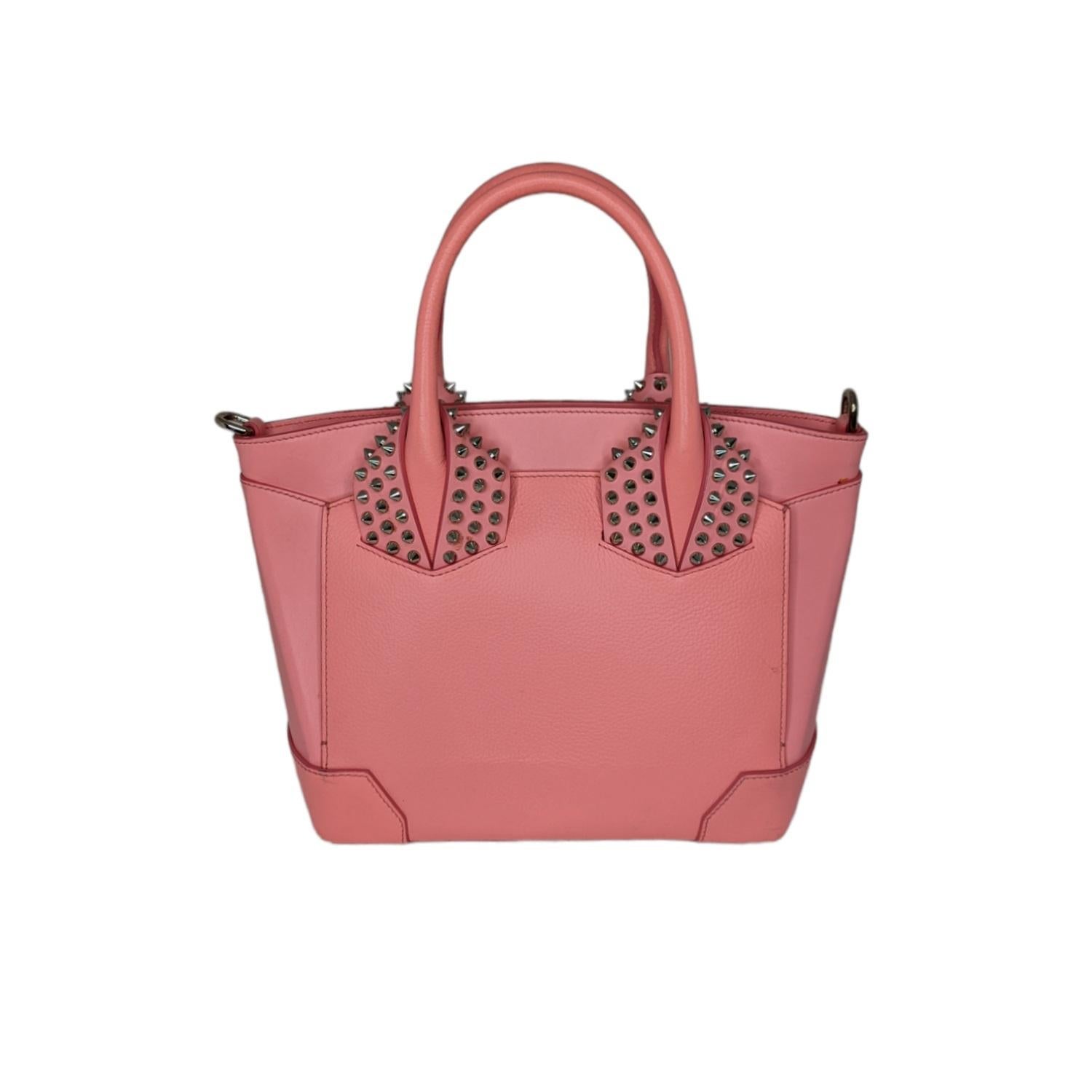 The Eloise by Christian Louboutin is praise to Italian craftsmanship. It features fine lines and a grand structure to delight women who believe in timeless glamor. This satchel comes made in pink leather accompanied by the signature element of